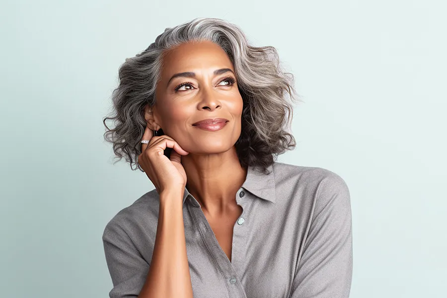 PDO-Threads-Doctor A gorgeous mature black woman with beautiful skin in a gray shirt. Get a PDO Thread Lift from Genifer Chavez, MD in Tucson.